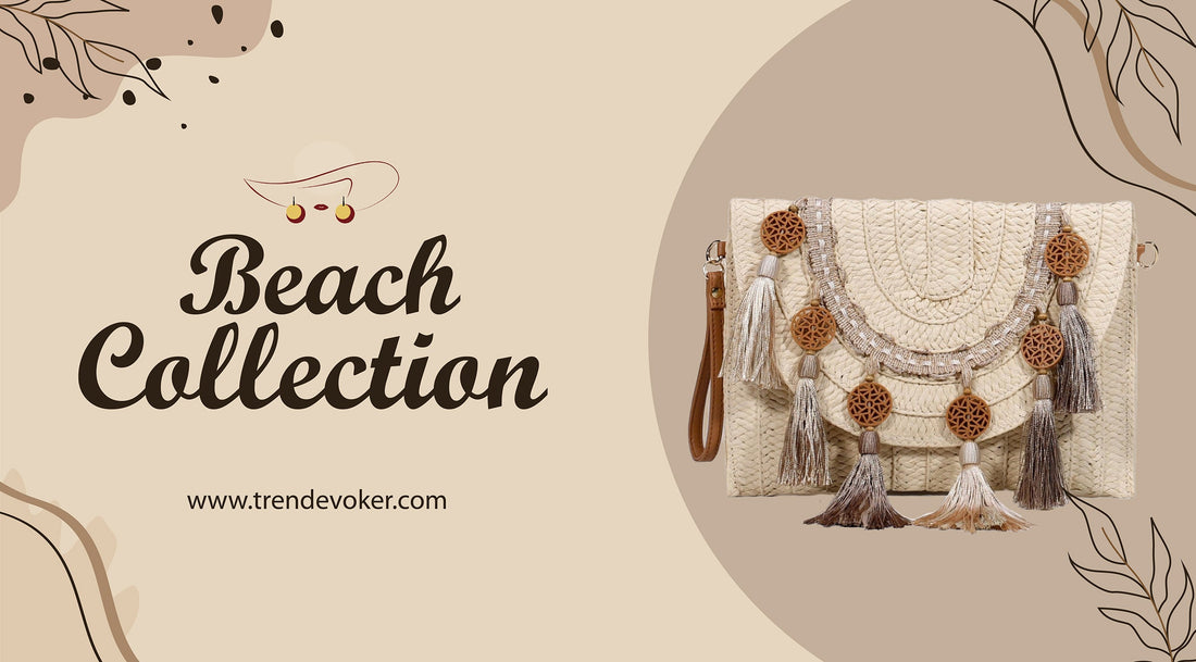 A trendy straw beach bag with fringe detailing, lying on a beach towel beside sunglasses and sandals.