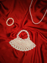 Close-up of premium beads on the off-white handmade bag