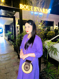 Model wearing the Skin and Black Wooden Cross Body Bag across the body, highlighting its elegant design