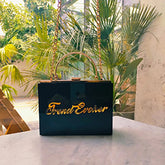 Elegant black and gold acrylic clutch bag for women, showcasing luxurious style