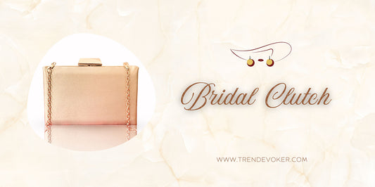 Elegant golden clutch bag for brides-to-be, featuring pearl embellishments and intricate design, ideal for weddings in Pakistan.