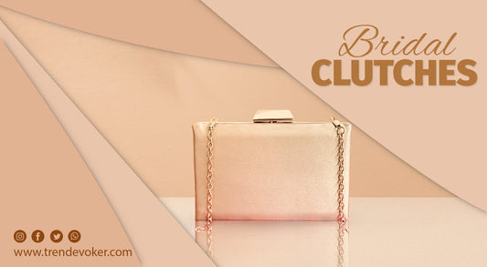 Elegant bridal clutch bag in gold with pearl embellishments – perfect for Pakistani wedding dresses.