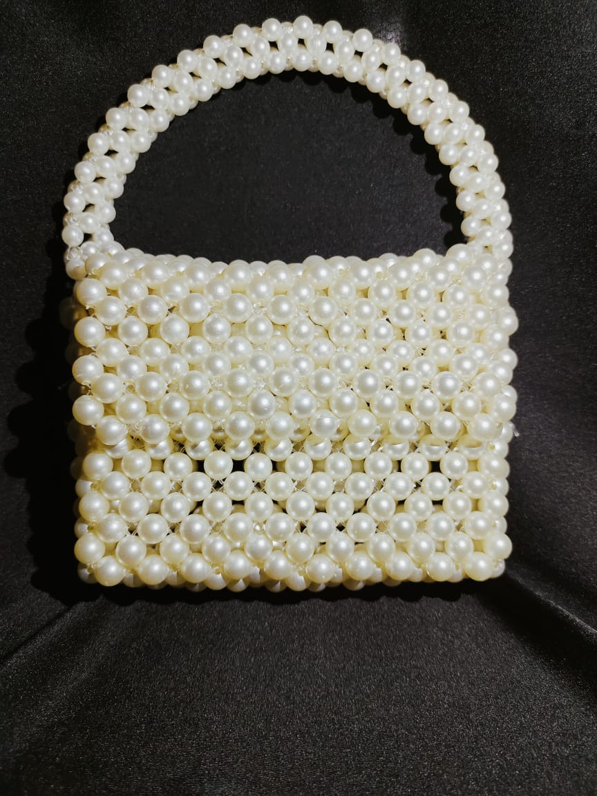 "OffWhite Mini Beaded Handbag, a sophisticated white beaded bag, designed as a handmade purse with customized features. This beaded shoulder bag stands out in the collection of hand made bags, offering elegance in the form of a beaded crossbody bag