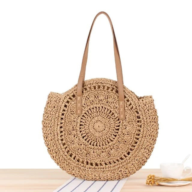 Large round handwoven paper straw beach tote bag in rich brown, inspired by Bali's bohemian summer vibes. 