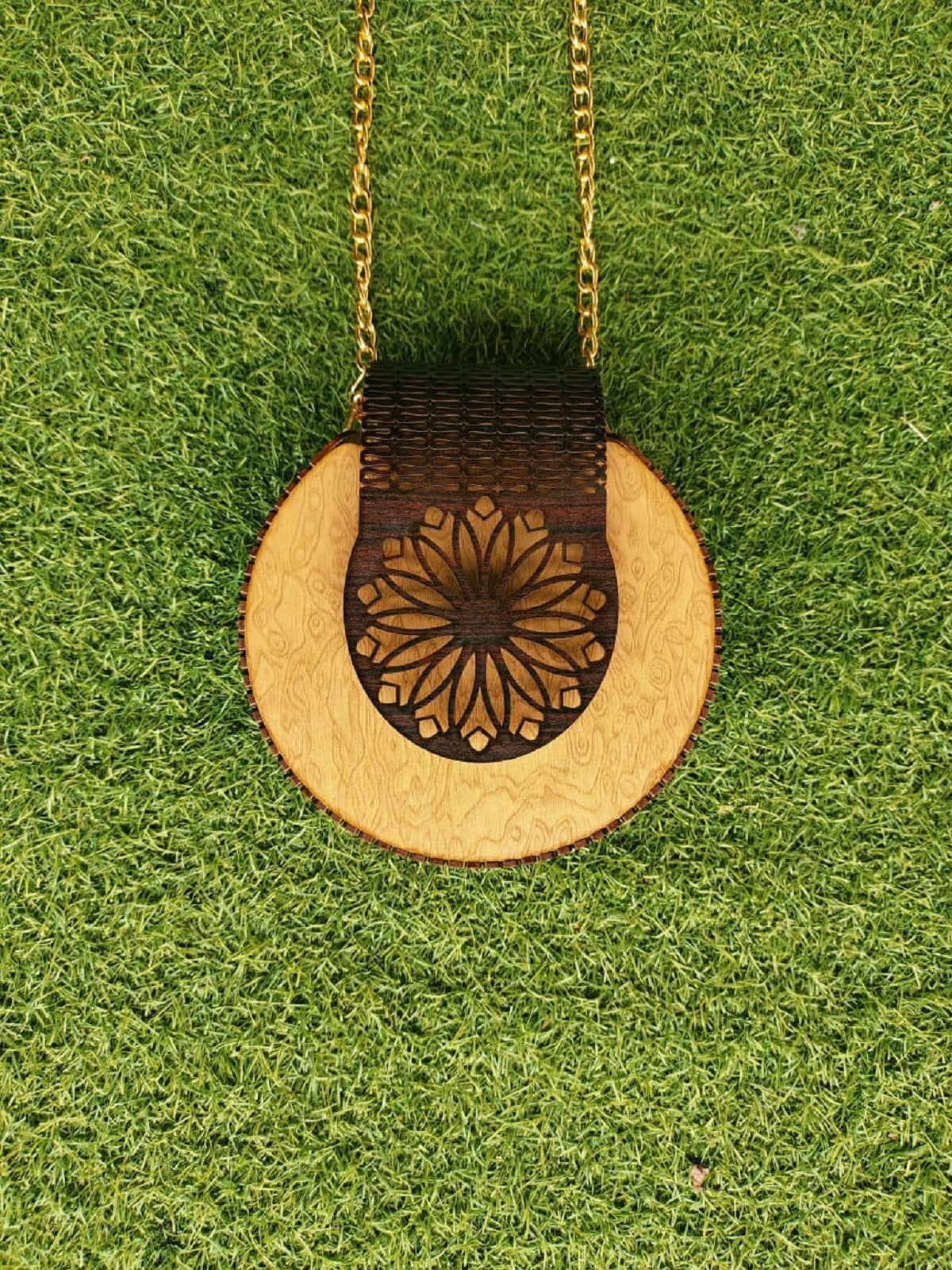 Handcrafted wooden purse in skin and black shades, showcasing a perfect blend of natural warmth and bold elegance