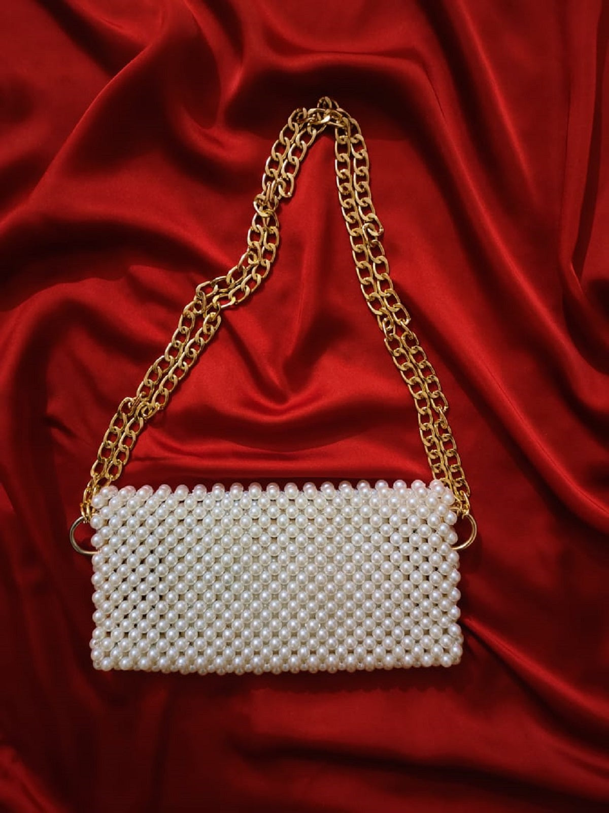 Interior view of the beaded shoulder bag, revealing its spacious and well-crafted design